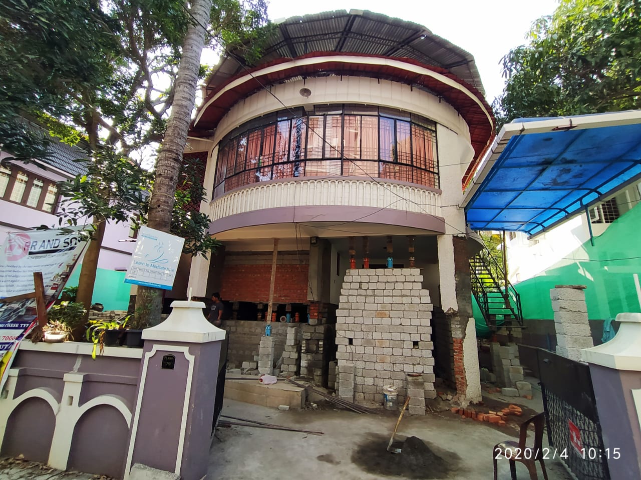 Two-Storey Residential House Raised 5 ft Above Road Level — Ernakulam, Kerala